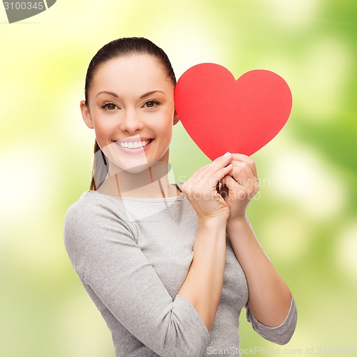 Image of smiling asian woman with red heart