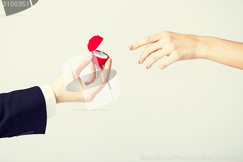 Image of couple with wedding ring and gift box