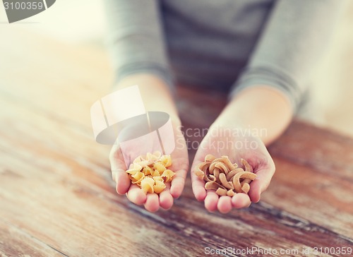 Image of female hands with different pasta variations
