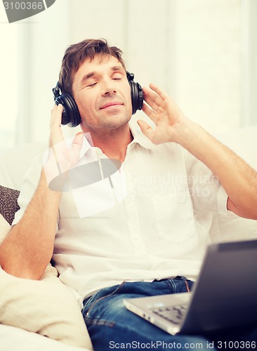 Image of man with headphones listening to music