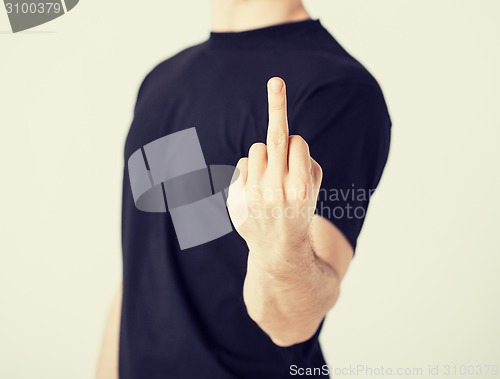 Image of man showing middle finger