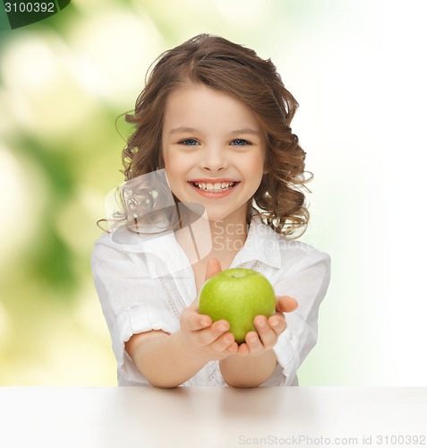 Image of happy girl with green apple 