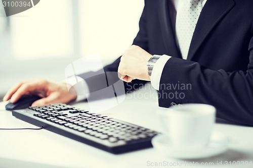 Image of man hands typing on keyboard