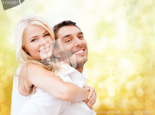 Image of happy couple having fun over lights background