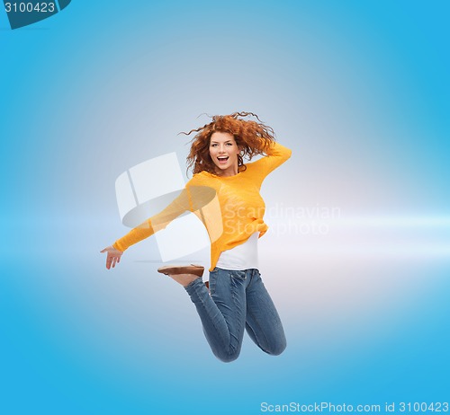 Image of smiling young woman jumping in air