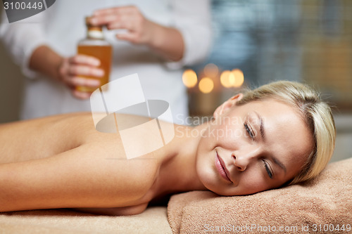 Image of close up of woman lying on massage table in spa