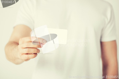 Image of man hand with blank paper