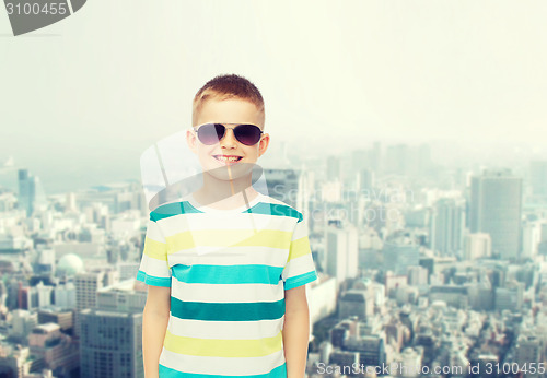 Image of smiling little boy over green background