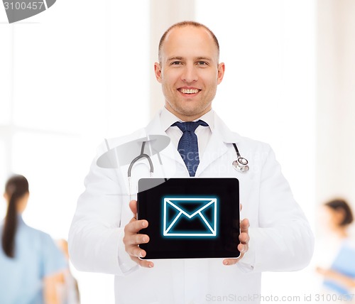 Image of smiling male doctor with stethoscope and tablet pc