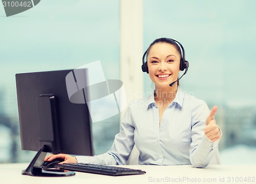 Image of female helpline operator showing thumbs up