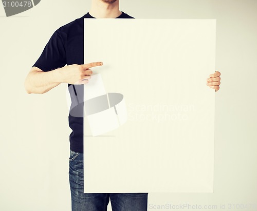 Image of man with blank white board