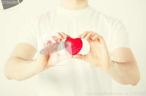 Image of man hands with heart