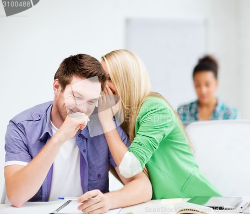 Image of group of students gossiping at school