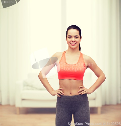 Image of smiling teenage girl in sportswear