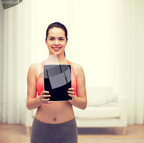 Image of sporty woman with tablet pc blank screen