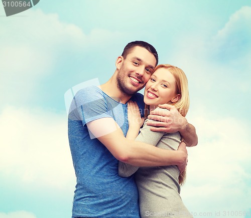 Image of smiling couple hugging