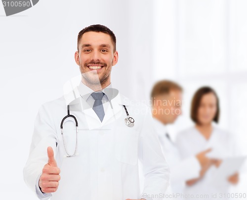 Image of smiling doctor with stethoscope showing thumbs up