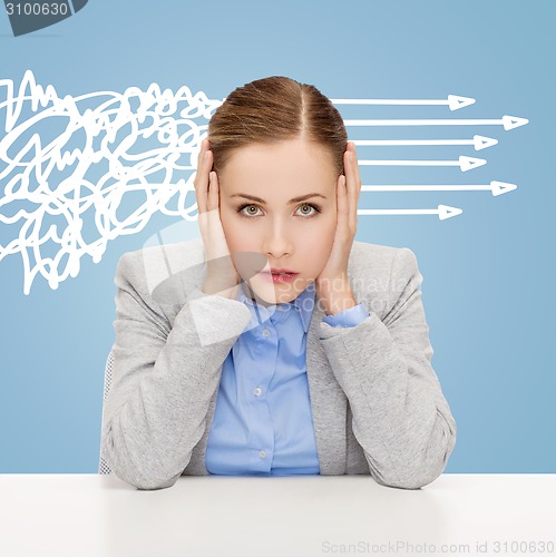 Image of stressed woman covering her ears with hands