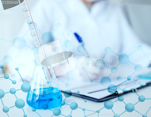 Image of close up of scientist making test in laboratory