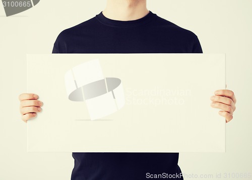 Image of man with blank white board