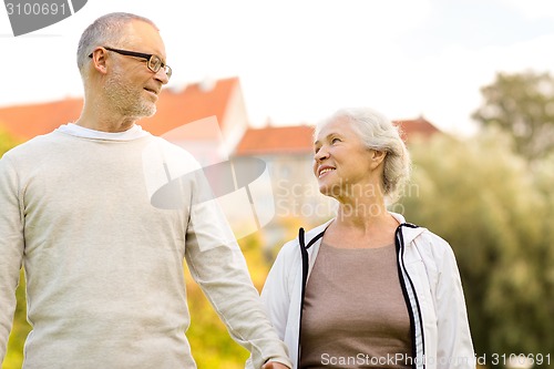 Image of senior couple in city park