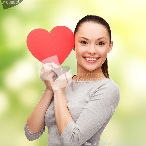 Image of smiling asian woman with red heart