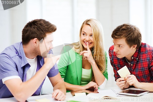 Image of group of students gossiping at school
