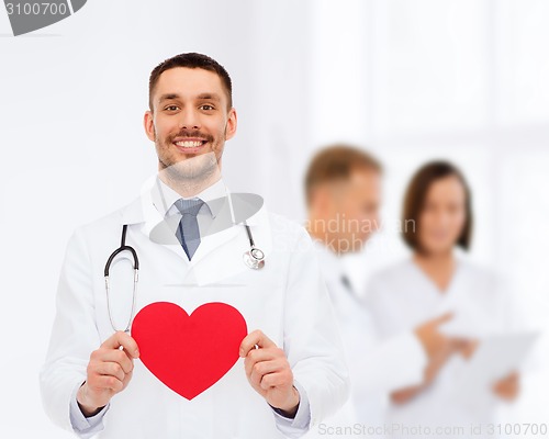 Image of smiling male doctor with red heart