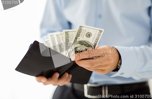 Image of close up of businessman hands holding money