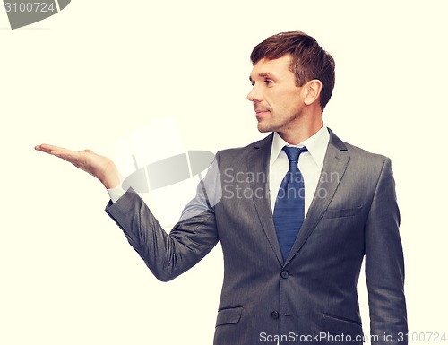 Image of buisnessman or teacher showing something