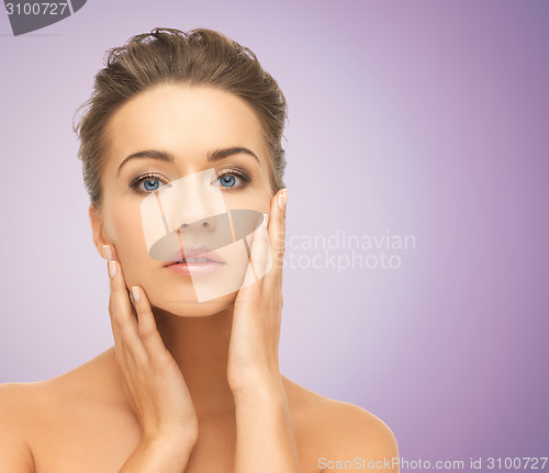 Image of beautiful young woman with bare shoulders
