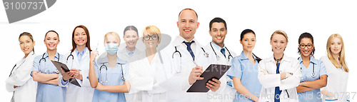 Image of group of smiling doctors with clipboard