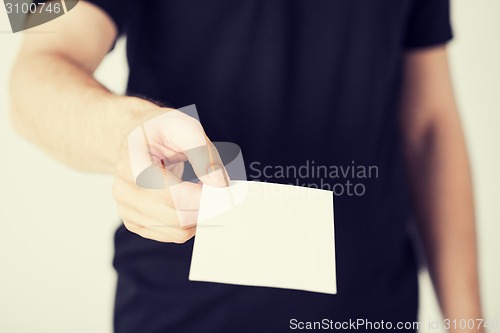 Image of man hand with blank paper