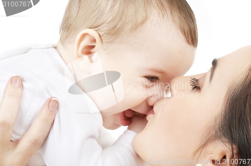 Image of mother kissing her baby