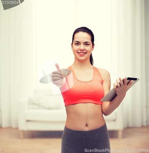 Image of sporty woman with tablet pc computer