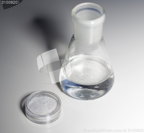 Image of close up of flask with water or liquid chemical