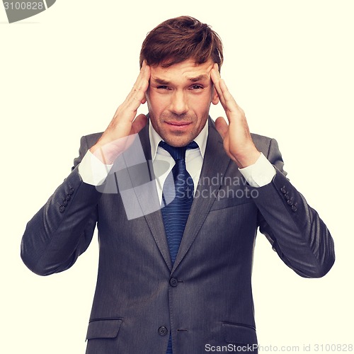 Image of stressed buisnessman or teacher having headache