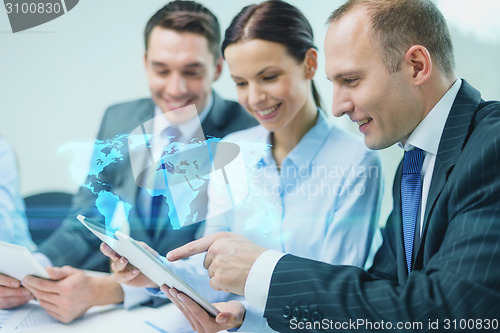 Image of business team with tablet pc having discussion