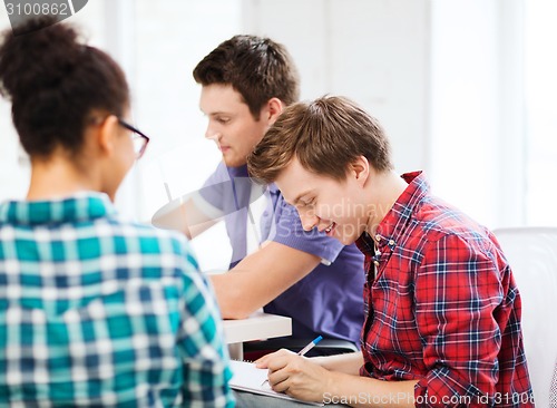 Image of student with notebook studying at school
