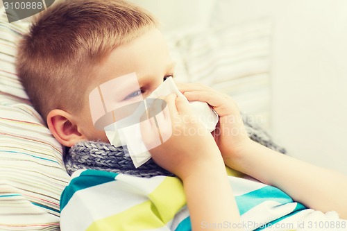 Image of ill boy with flu at home