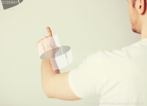 Image of man hand pointing at something