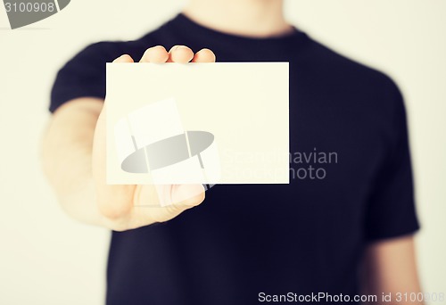 Image of man hand with blank paper