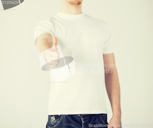 Image of man showing thumbs up