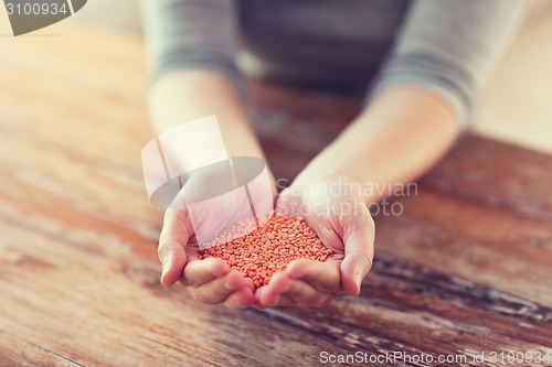 Image of cloes up of female cupped hands with quinoa