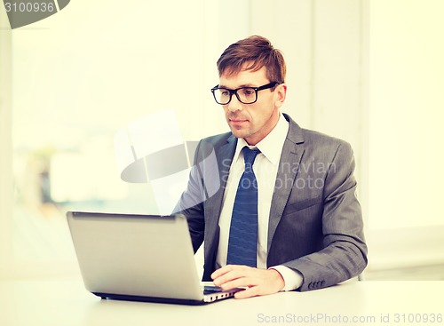 Image of businessman working with laptop computer