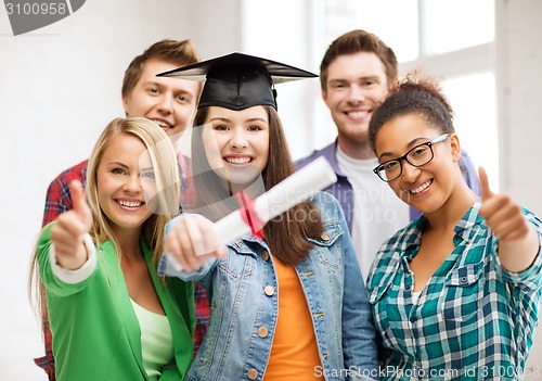 Image of student girl in graduation cap with diploma