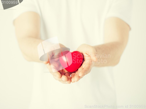 Image of man hands with heart