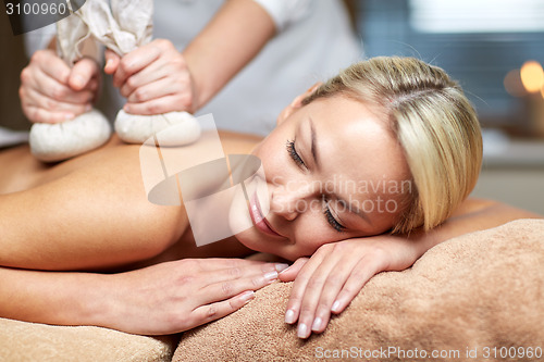 Image of close up of woman lying on massage table in spa