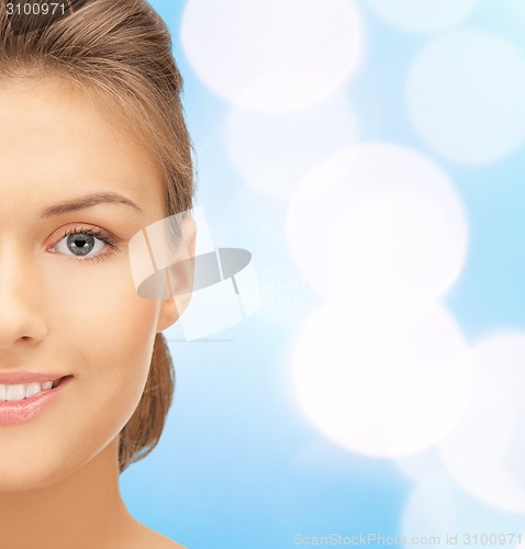 Image of beautiful young woman half face