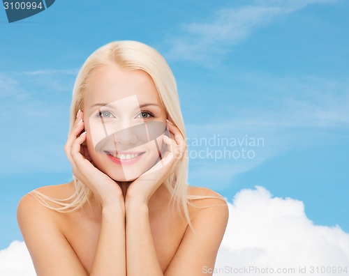 Image of beautiful woman touching her face skin